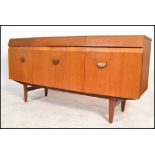 EoN - Elliots of Newbury - A retro 1970's bow fronted teak wood sideboard having shaped cup