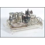 A collection of vintage 20th century silver plates items to include toast rack, sugar shaker,