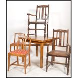 A 1930's oak draw leaf dining table of square form together with 2 oak carver chairs and a set of