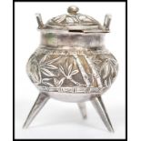 An unusual 19th century Chinese silver condiment in the form of a censer ding bowl raised on