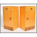 A pair of 1930's Art Deco birds eye maple bedside cabinet lockers. Each raised on a plinth base with