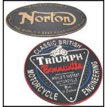 A pair of vintage style cast metal point of sale advertising garage wall plaques for Norton and