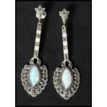 A pair of 925 silver Art Deco style marcasite and opal drop earrings having post backs. Marked 925.
