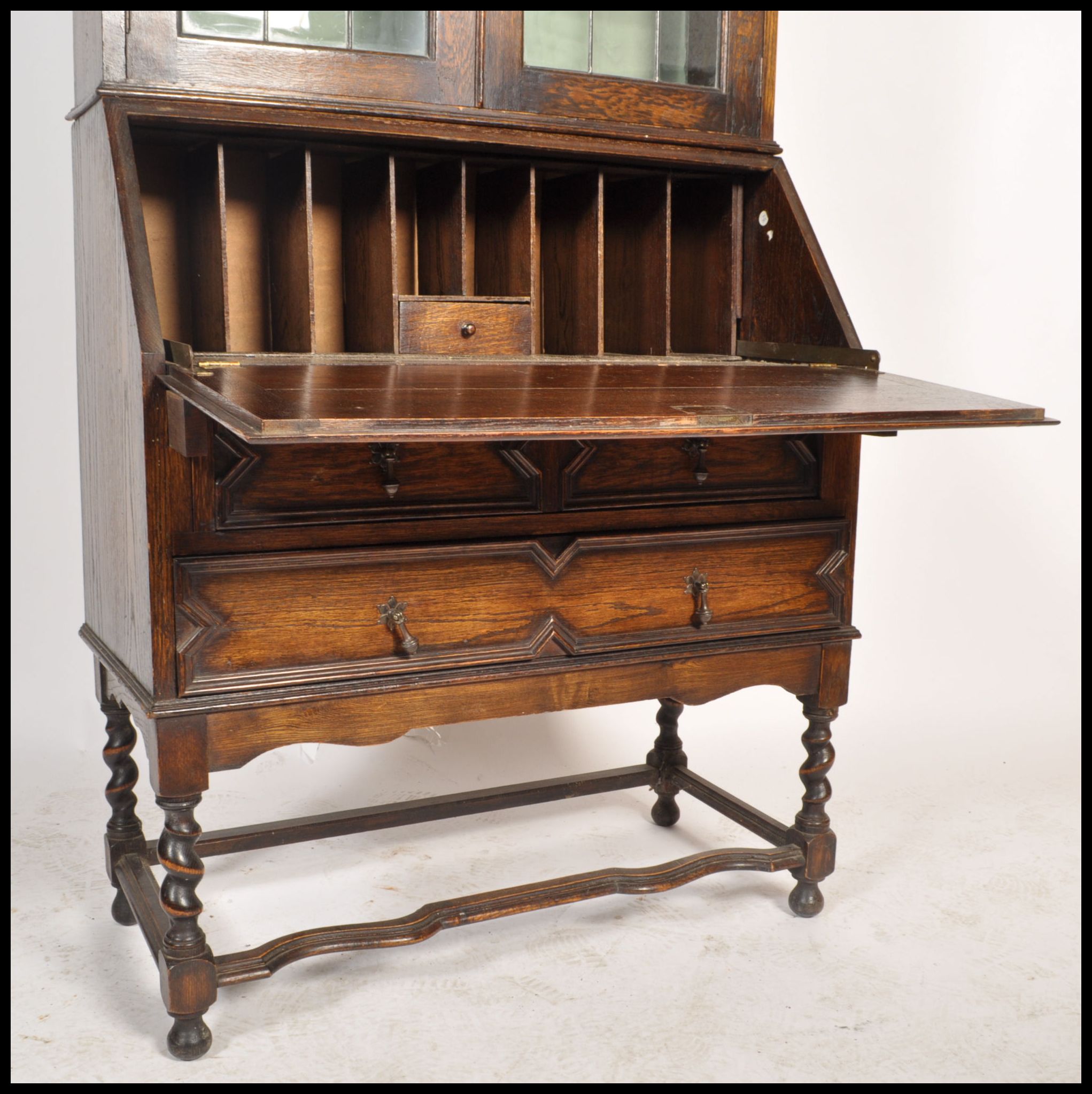 An early 20th century oak Jacobean revival bureau bookcase. Raised on barley twist supports with - Image 3 of 5