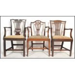 A set of three harlequin 19th century Georgian mahogany carver dining chairs Hepplewhite manner