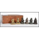 A 19th century birds eye maple wooden box containing a collection of Oriental Chinese bronze and