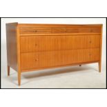 A 1950's vintage sideboard with 3 drawers along top and long long full length drawrs with rim top