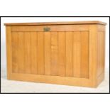 An unusual mid century large oak eclesiastical vestment - front chest coffer. Of light oak form with