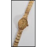 A 20th century  ladies 9ct gold cased bracelet watch by H Samuel, having quartz movement set to a