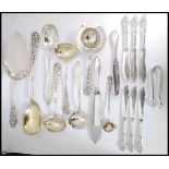 A collection of Danish Silver Plated serving spoons and ladels each with  with intricate rococo