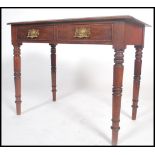A Victorian mahogany writing table desk being rais