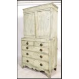 A 19th century shabby chic country cabinet on chest of drawers / dresser. Raised on bracket feet