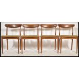 A set of 4 1970's teak and faux leather Danish influence ' propeller ' back dining chairs being