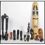 A large collection of tribal African related items to include busts, wall masks, hair fly swat whisk