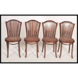 A  set of 4 contemporary retro style bentwood cafe dining chairs raised on turned legs with pad
