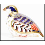 A Royal Crown Derby Red Legged Partridge paperweight, with red stamp to underside, dated 2015 and