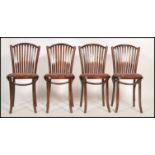A set of 4 contemporary - retro style bentwood cafe chairs raised on turned legs with panel seats