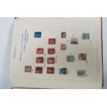 A vintage stamp album containing various stamps dating from the 19th century. Great Britain and