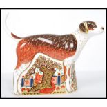 A Royal Crown Derby paperweight of a dog, Foxhound, with gold stopper, red stamp to base, dated to