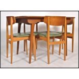 A 1970's retro teak wood dining table having tapering sqaured legs with extending top, the chair