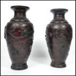 A pair of 19th century Oriental Bronze vases raise