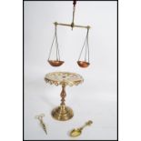 A late 19th century brass tazza / cake stand, raised on a turned base with an ecclesiastical fret
