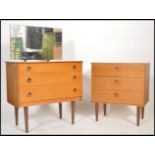 A retro 20th century teak wood dressing table and matching chest of drawers  each with tapering legs