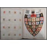 A Victorian album of Arms, Crests & Monograms having a fabulous collection of applied clipped