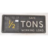 A vintage mid century Industrial cast metal warning sign with notation for ' Safe Tons Working