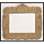 A 19th century Victorian brass framed wall mirror. The central bevelled glass panel having a