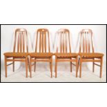 A set of 4 20th century Nathan furniture dining chairs in teak being raised on tapering legs with
