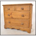 A 19th century Victorian country cottage scrubbed pine two short over two long chest of drawers,