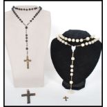 A group of vintage religious ecclesiastical jewellery to include a carved mother of pearl rosary