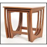 A 1970's G-Plan ' Astro ' teak wood nest of tables. The tables of graduating form with each being