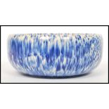 A vintage 20th century blue crystal line half fire glaze bowl in the manner of Ruskin pottery.
