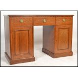 An Edwardian mahogany inlaid twin pedestal office desk. Raised on plinth bases with locker doors and