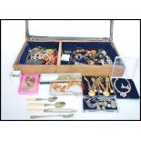 A collection of vintage and contemporary costume jewellery to include brooches, necklaces, bangles