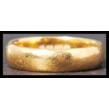 A hallmarked 22ct gold band ring of usual form weighing 5 g and measuring size