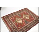 A 20th century wool rug of Persian / Islamic style