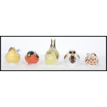 A collection of five Royal Crown Derby paperweights to include House Sparrow, Bullfinch ,