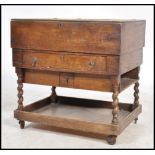 An early 20th century oak cased Artists work box, hinged top opening to reveal a fully appointed