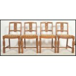 A set of 4 1930's Art Deco oak dining chairs being