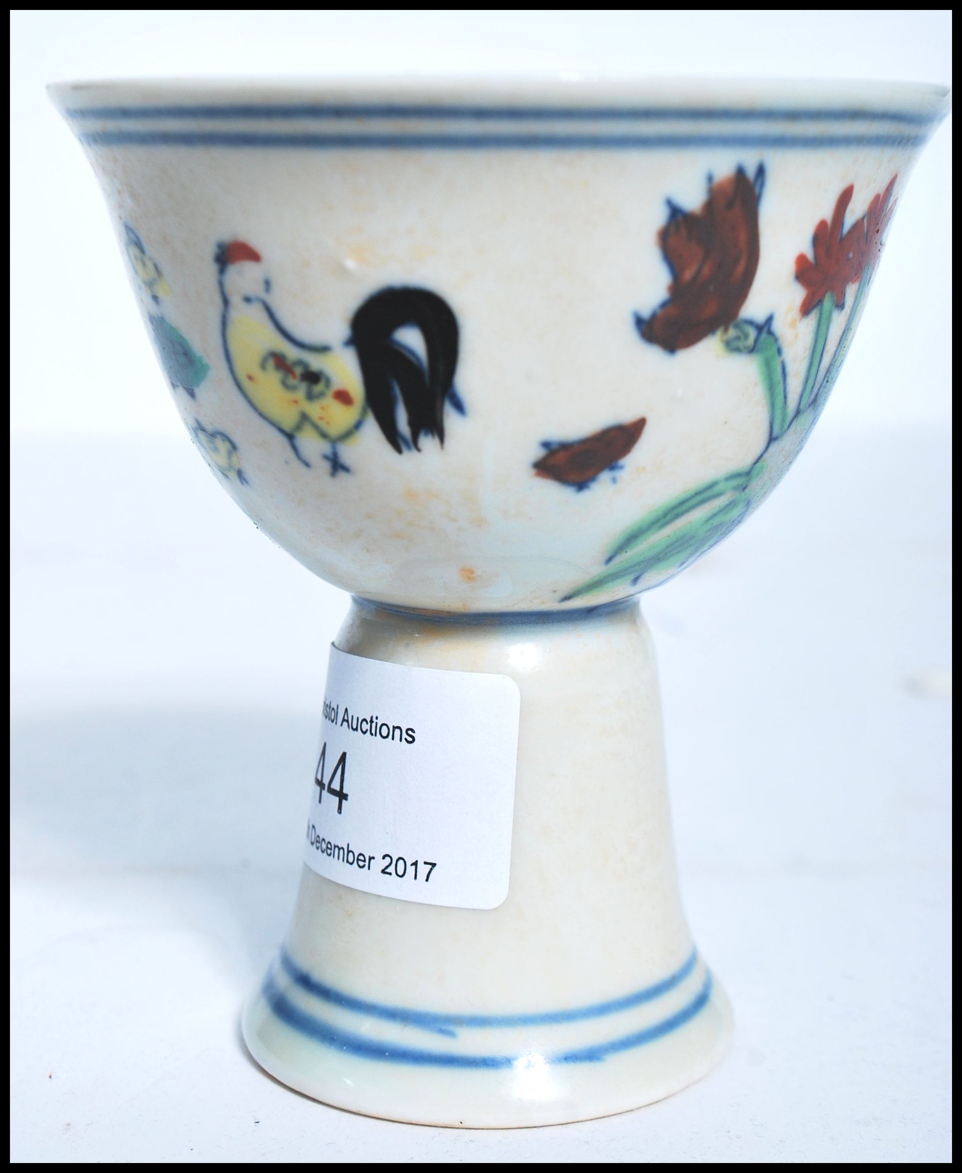 A 19th century Oriental Chinese sake cup depicting flowers with concentric blue circles and blue - Image 2 of 5
