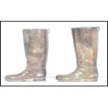 A pair of 20th century silver plated boot measures for spirits. one boot measures a single and the