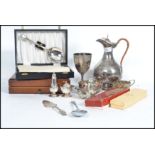 A collection of vintage 20th century silver plated wares to include a carafe by Walker and Hall,
