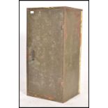 A retro 20th century industrial two tone painted metal storage cabinet locker. Of upright form