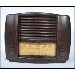 A vintage mid 20th century Bakelite GEC model BC4850 - L valve radio, dials and display to front.