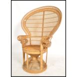 A good 20th century vintage late 1970's retro wicker peacock armchair -chair. Large open back
