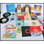 Vinyl Records - A collection of 45rpm vinyl 7" singles featuring various artists to include Peter
