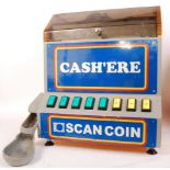 A late 20th Century arcade Scancoin cash'ere machine, used for dispensing smaller change / currency.